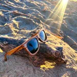 Sunglasses for while surfboarding. They float for easy retrieval. Real wood